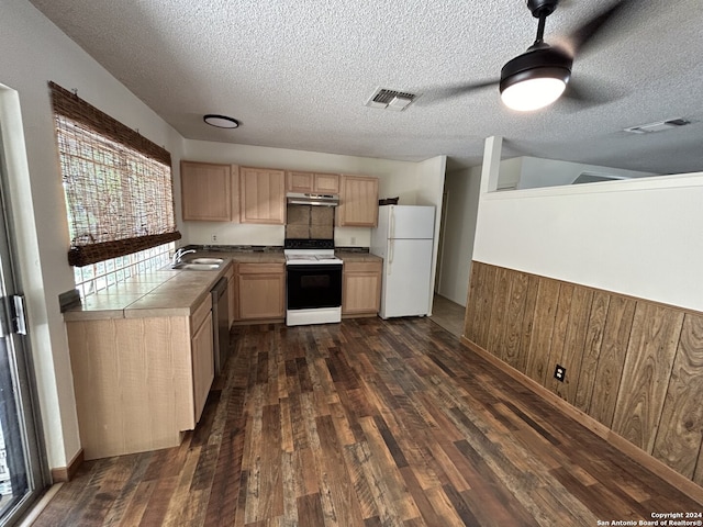 kitchen with white appliances, a textured ceiling, sink, ceiling fan, and dark wood-type flooring