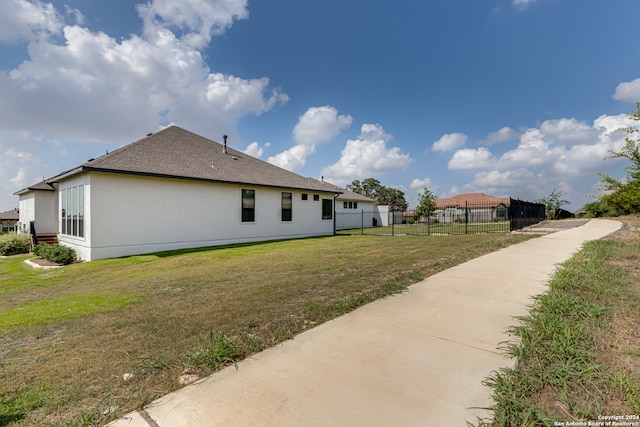 view of home's exterior featuring a yard