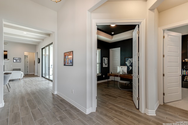 hall with hardwood / wood-style floors