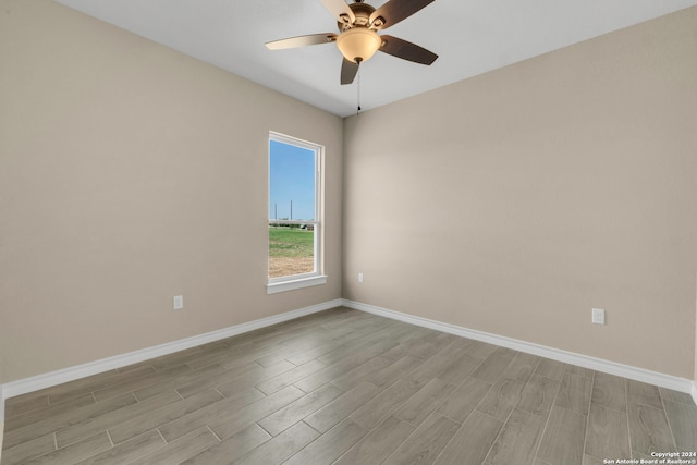 unfurnished room featuring ceiling fan and light hardwood / wood-style floors