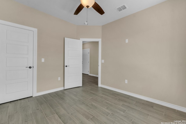 unfurnished bedroom featuring ceiling fan and light wood-type flooring