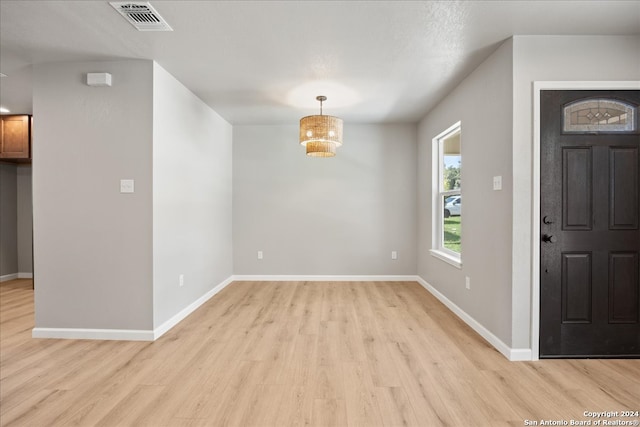 foyer entrance with light wood-type flooring