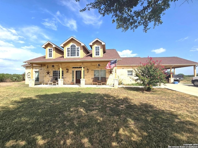 view of front facade featuring a front lawn and a carport