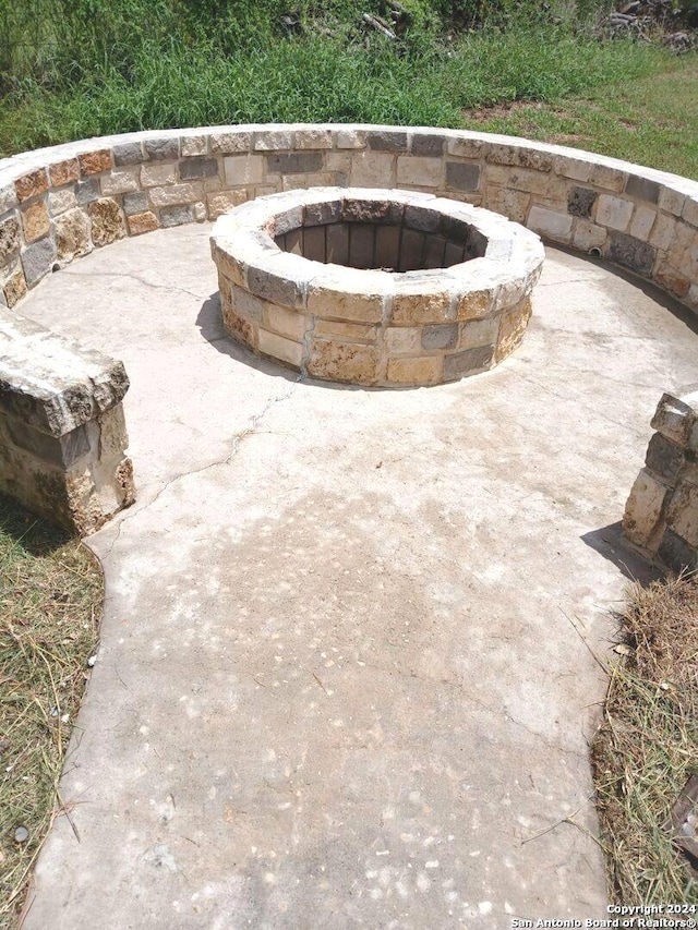 view of patio featuring a fire pit