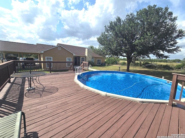 view of swimming pool featuring a deck