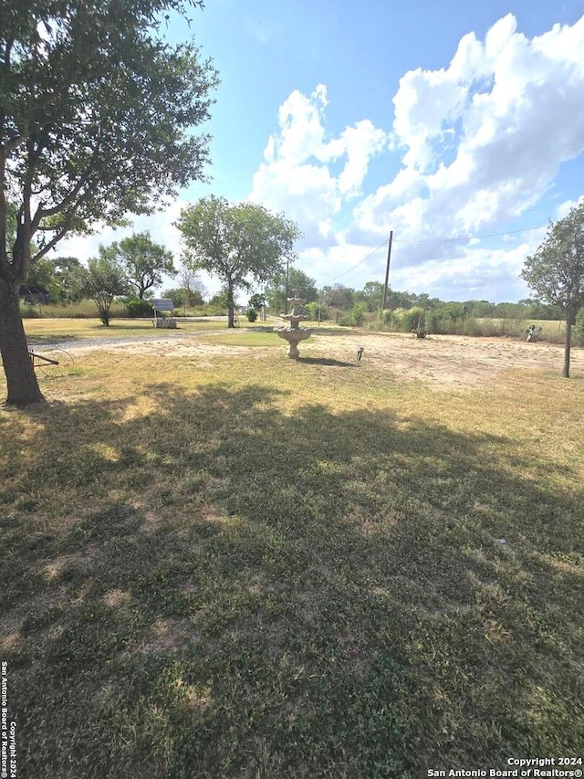 view of yard with a rural view