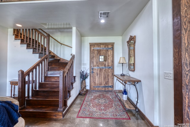 foyer featuring concrete flooring