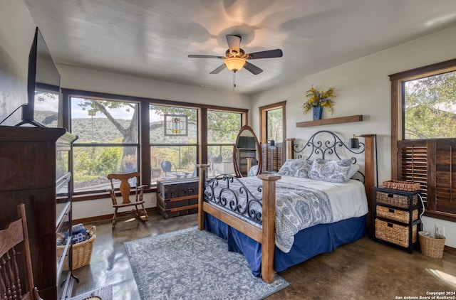 bedroom with concrete floors and ceiling fan