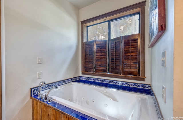 bathroom with a relaxing tiled tub