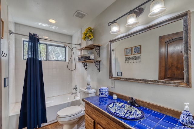 full bathroom featuring vanity, toilet, shower / bath combination with curtain, and wood-type flooring