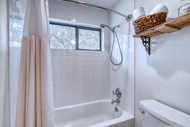 bathroom featuring toilet and shower / tub combo