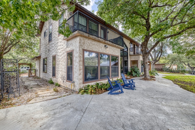 rear view of house with a balcony