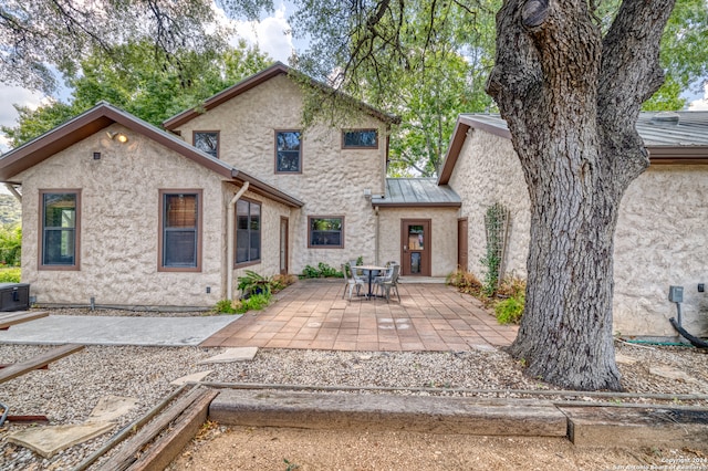 rear view of house featuring a patio area