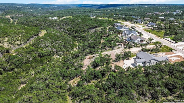 aerial view featuring a wooded view