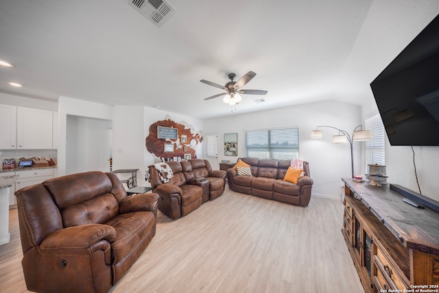 living room with light wood-type flooring and ceiling fan