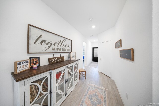 hallway featuring light hardwood / wood-style flooring