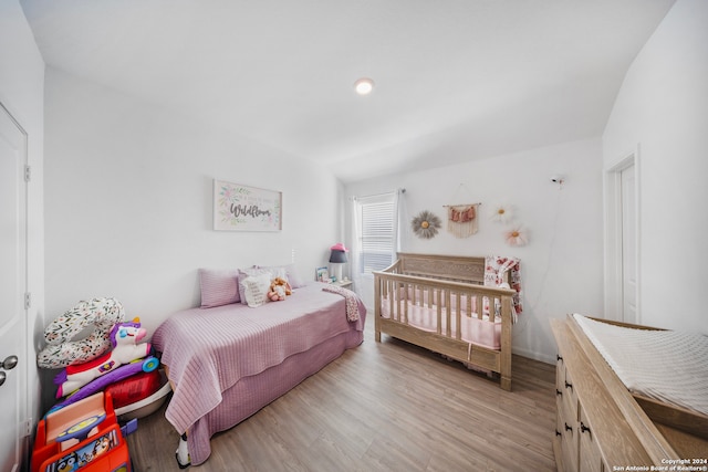 bedroom with light hardwood / wood-style floors