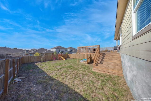 view of yard with a wooden deck