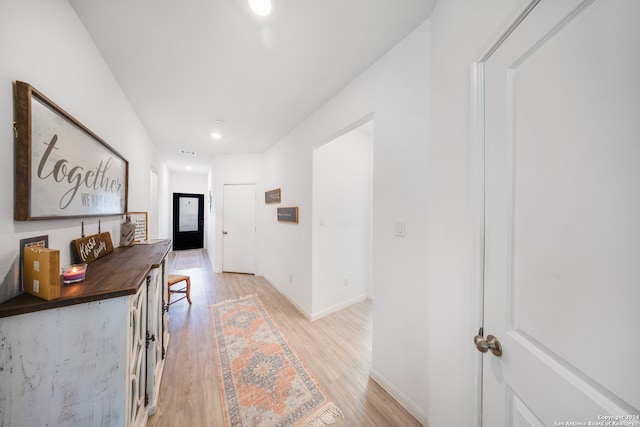 hallway featuring light wood-type flooring