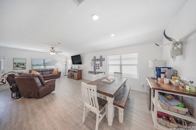 dining room with ceiling fan and light hardwood / wood-style flooring