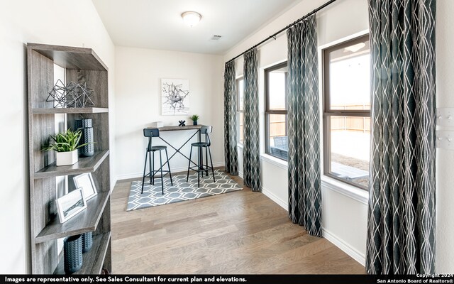 dining space with hardwood / wood-style flooring