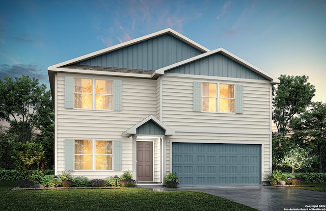 view of front facade with a front yard and a garage