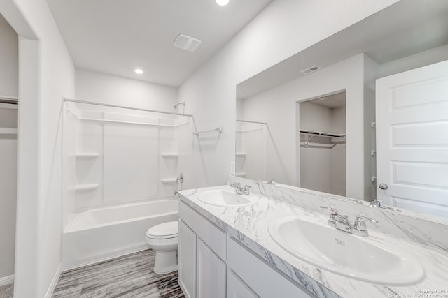 full bathroom featuring vanity, toilet, and bathtub / shower combination