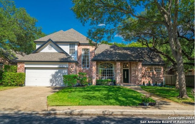 view of front of home featuring a garage and a front yard