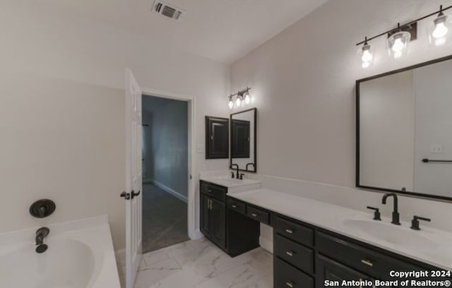 bathroom featuring vanity and a bathing tub