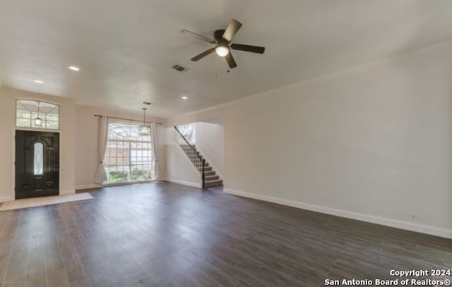 unfurnished living room with dark wood-type flooring and ceiling fan