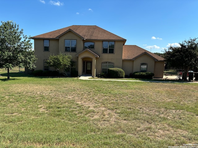 view of front of home featuring a front lawn