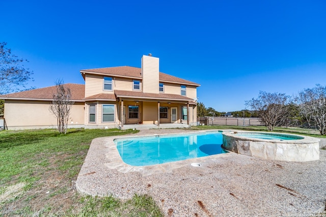 view of pool featuring an in ground hot tub and a patio area