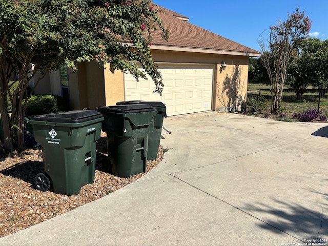 view of property exterior with a garage