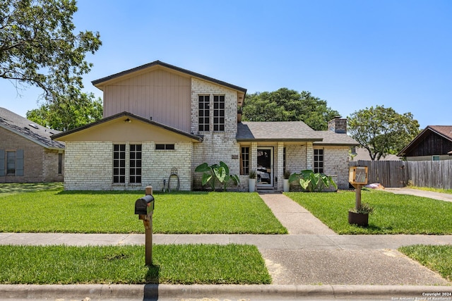 212 San Saba, Portland, TX 78374 - tri-level home featuring a chimney and brick siding