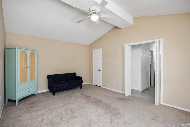 sitting room featuring lofted ceiling, light colored carpet, ceiling fan, and a textured ceiling