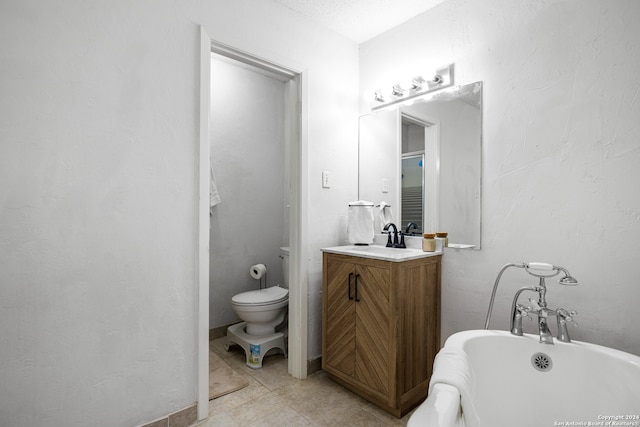 bathroom featuring vanity, a bath, toilet, and tile patterned floors