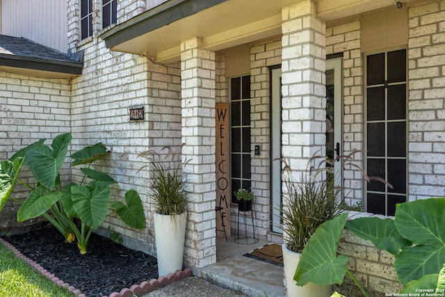 view of exterior entry with covered porch