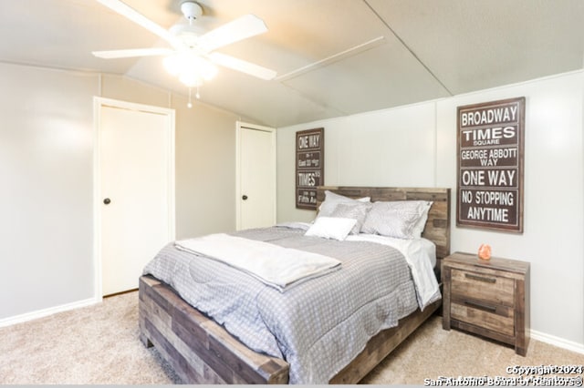 carpeted bedroom featuring ceiling fan and lofted ceiling