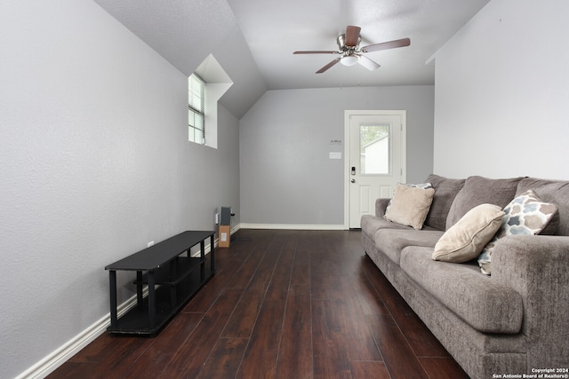 living room featuring ceiling fan, dark wood-type flooring, and lofted ceiling