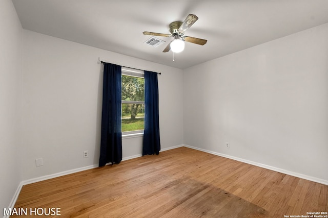 unfurnished room with light hardwood / wood-style flooring and ceiling fan