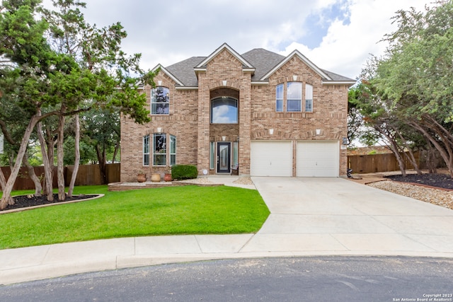 view of front of house with a front lawn and a garage