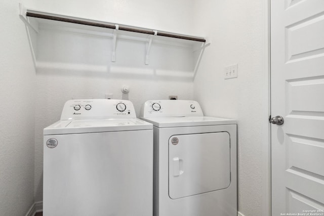 washroom with laundry area and washing machine and clothes dryer