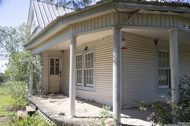 view of property exterior with covered porch