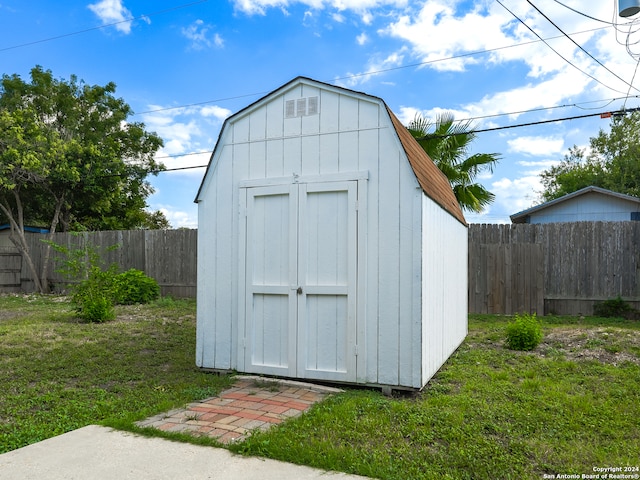 view of outdoor structure with a lawn