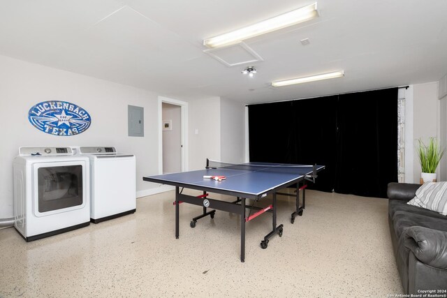 playroom featuring electric panel and washer and clothes dryer