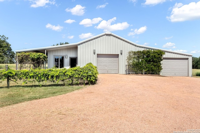 view of front of home featuring a detached garage and board and batten siding