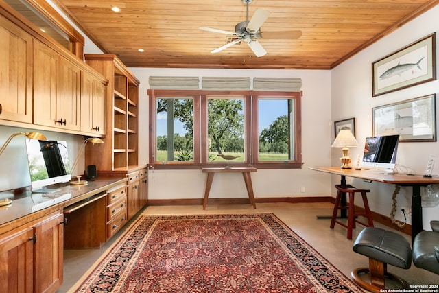 home office featuring a wealth of natural light, built in desk, ceiling fan, and ornamental molding