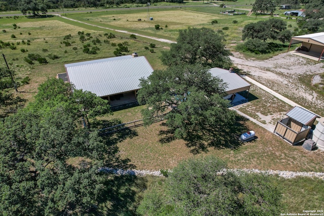 birds eye view of property with a rural view