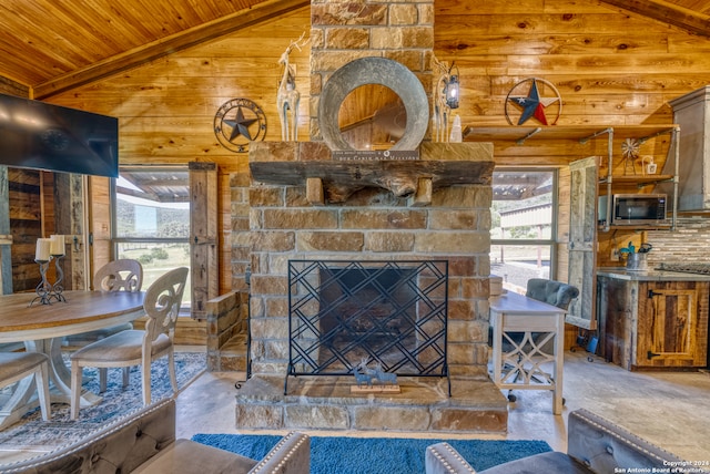 living room featuring a fireplace, high vaulted ceiling, concrete flooring, and wooden ceiling