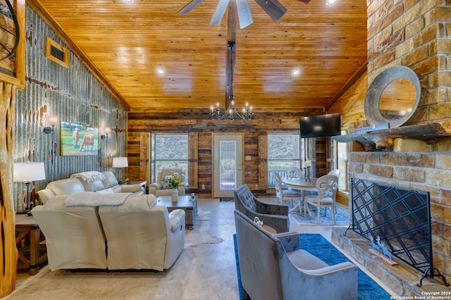 living room featuring vaulted ceiling, ceiling fan with notable chandelier, concrete flooring, a fireplace, and wood ceiling